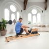 Flow Fitness roeitrainer Perform W9i Oak die als beste getest is door kieskeurig.nl. Gezien van zijzijde